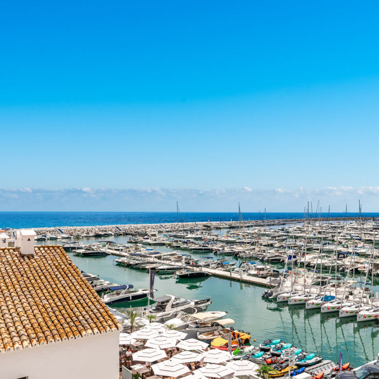 A luxurious and  contemporary designed apartment located within the the famous marina of Puerto Banus