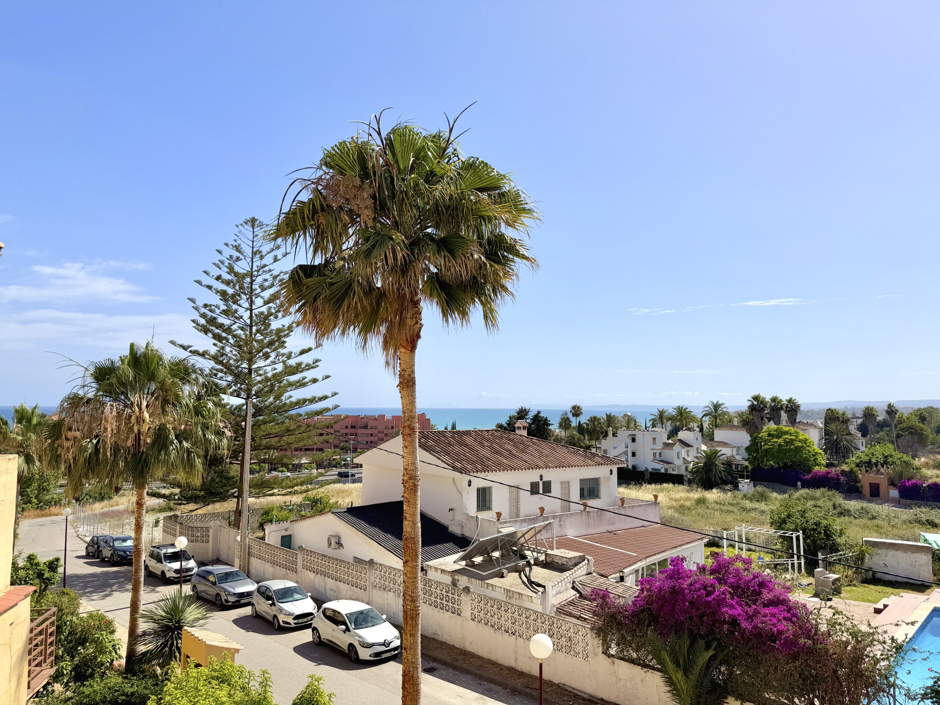 Town house in Cancelada Estepona East with sea and mountain views private garden roof terrace communal pool and garage for two cars