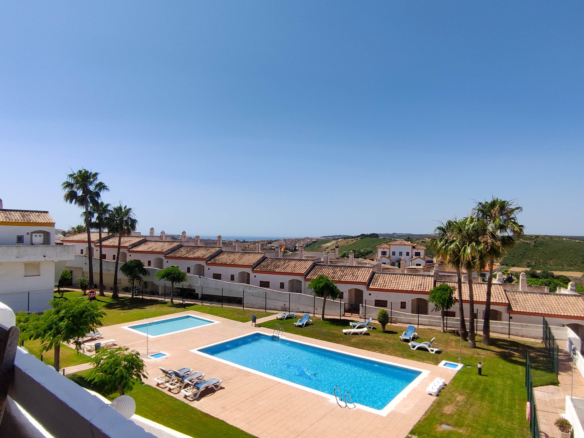 2-Bedroom Duplex with Solarium, Private Garage and Direct Pool Access in Royal Manilva