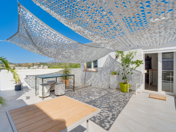 Unique five bedroom townhouse with rooftop terrace & excellent rental potential in Cancelada, Estepona