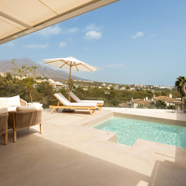 Panoramic sea, lake and La Concha views meet modern design, a private plunge pool and stylish outdoor living in Les Belvederes, Nueva Andalucia.