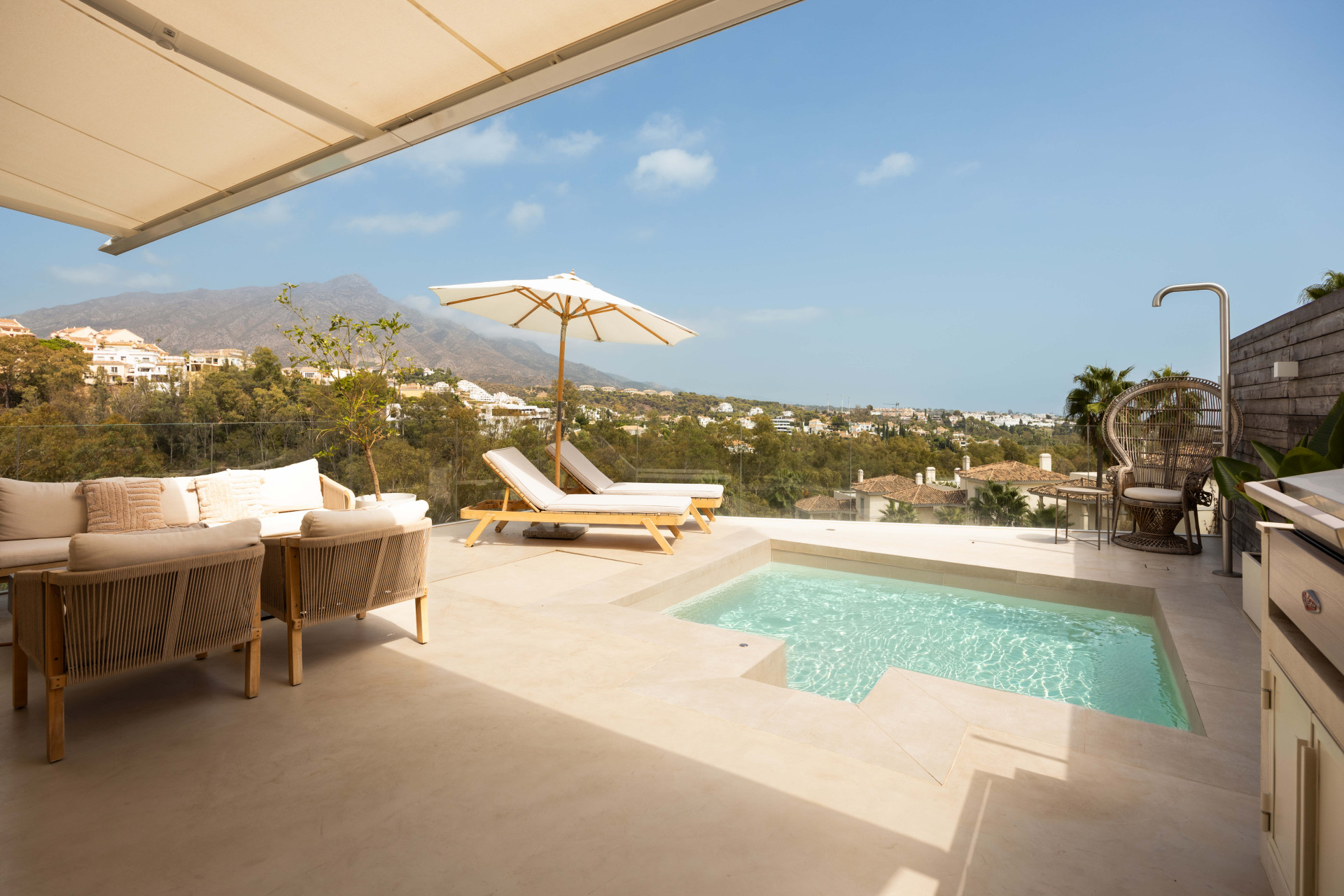 Panoramic sea, lake and La Concha views meet modern design, a private plunge pool and stylish outdoor living in Les Belvederes, Nueva Andalucia.