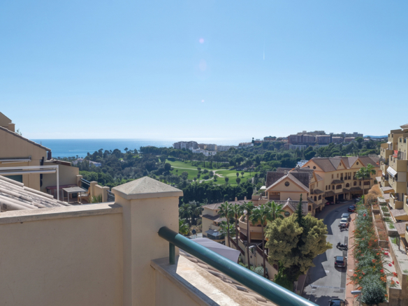 A furnished southwest-facing duplex penthouse in Torrequebrada with panoramic sea and golf views, expansive terraces and two garage parking spaces.